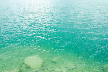 The detail of the surface of the glacier lake with its azure water caused by the calcite and minerals. 