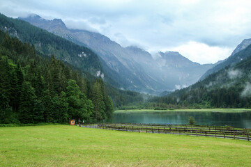 The glacier lake Jägersee in Austria in the Alps during the rainy and cloudy day. Travel destination for the tourists. 