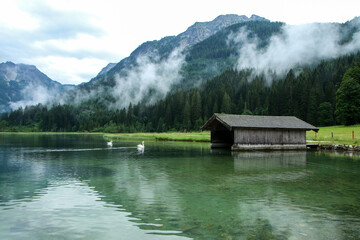 The glacier lake Jägersee in Austria in the Alps during the rainy and cloudy day. Travel destination for the tourists. 