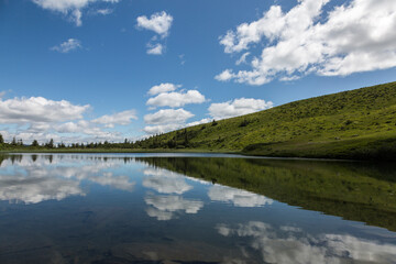 The water surface of a blue lake against the background of the Gorgan mountain range, Carpathians