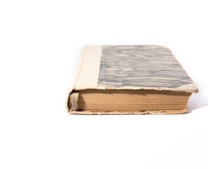 An old book with a yellowed cover. Old book isolated on a white background.