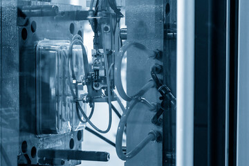 The automatic operation of plastic injection machine with robotic system.