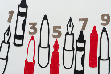 paper silhouette shapes and numbers on blank paper