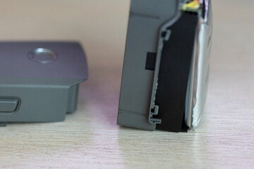 Disassembled drone battery, swollen battery, repair and maintenance of Li-ion power supply for quadrocopter