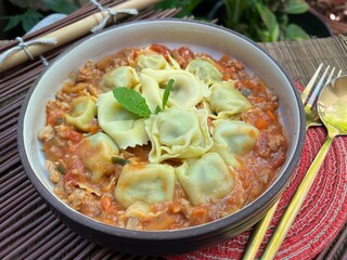 Ravioli stuffed with chopped spinach Parmesan Cheese and Ricotta Cheese with Stir Fried Pork with Sour Sauce