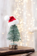 Christmas tree on bohek wooden, bokeh background.