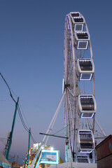 Fototapeta premium fairground wheel at night illuminated with led lights