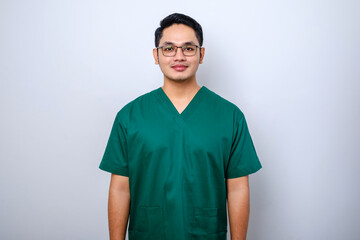 Professional good-looking asian doctor, medical worker in glasses and scrubs, cross arms and smiling