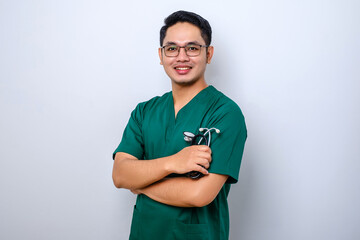 Professional good-looking asian doctor, medical worker in glasses and scrubs, cross arms and smiling