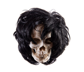 Human skull with hair isolated on white background