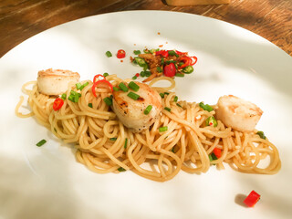 Spaghetti scallops with fresh chili and himalayan salt.