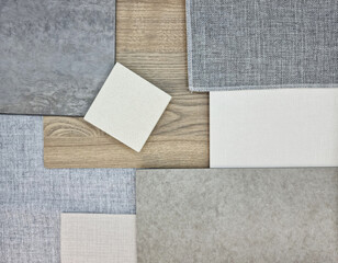 close up view of interior material samples including quartz stone, concrete vinyl flooring, grey...