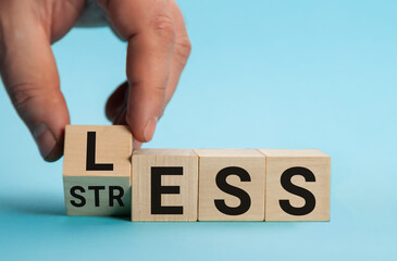 Having less stress or being stress-less. The word on wooden cubes. The concept of having less...