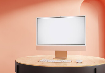 Coral iMac on the rounded table - obrazy, fototapety, plakaty