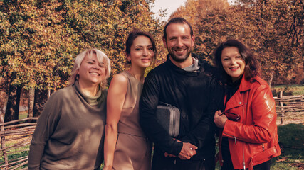 Group of friends having fun in autumn park