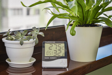 Thermometer hygrometer measuring the optimum temperature and humidity in a house