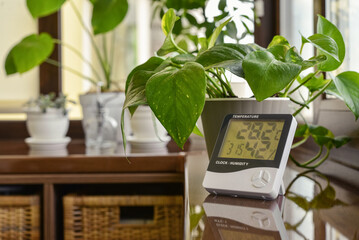 Thermometer hygrometer measuring the optimum temperature and humidity in a house