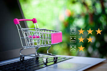 A trolley on laptop keyboard concept about online shopping, take life easy and better life,...
