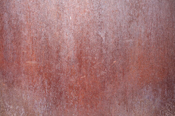 A red metal background with a stained vintage look.