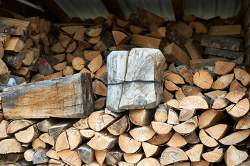 wooden cabin with logs, blocks and wooden plugs for the home fire