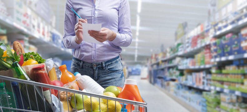 Woman checking a shopping list