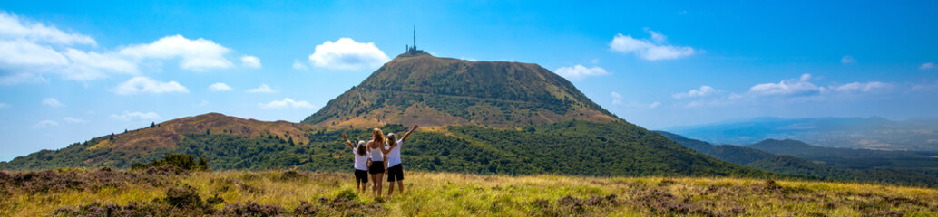 hiker family looking at beautiful view of Auvergne landscape- Puy de Dome © M.studio