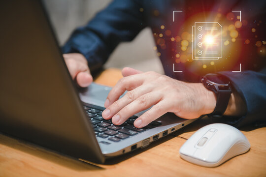 A man uses a smartphone to access an online document database. and automated processes to store files and documents in the organization effectively with enterprise business ERP technology