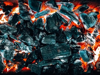 Hot coals. Background with glowing hot coals. burnt wood