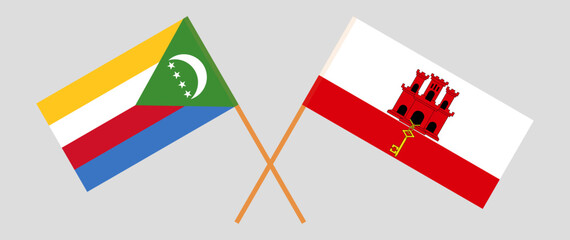 Crossed flags of the Comoros and Gibraltar. Official colors. Correct proportion