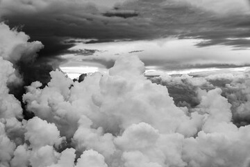 Above the sky. Clouds in black and white.