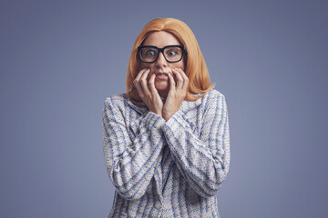 Scared funny businesswoman with glasses