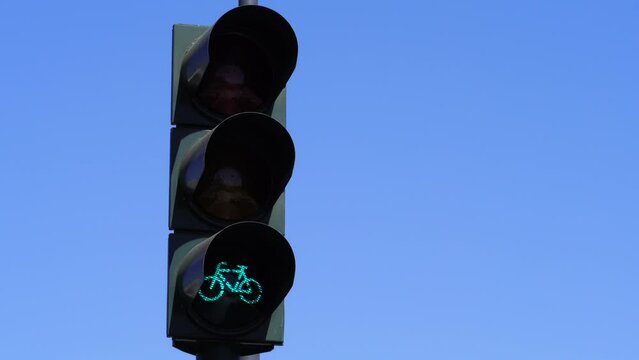 Bike traffic light, green and white bicycle background