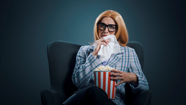Woman watching a drama movie at the cinema