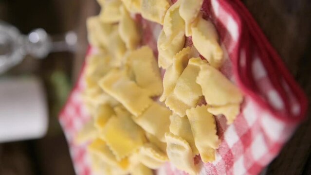 Plin del Piemonte. ravioli del plin typical Piedmontese filled pasta from the Langhe in Italy seasoned. Hot steam coming from the plate. High quality FullHD footage