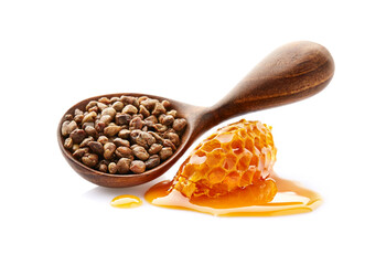 Propolis granule in wooden spoon with honeycomb. Natural antibiotic
