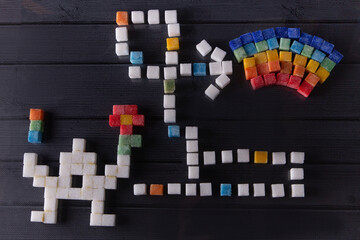 Sugar cubes game. Top view on sugar cube pixel monster holding flower and going by labyrinth to the...
