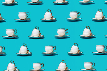 Elegant, retro style coffee cups, creative pattern on turquoise blue background. 
