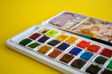 A colorful watercolor palette used for painting