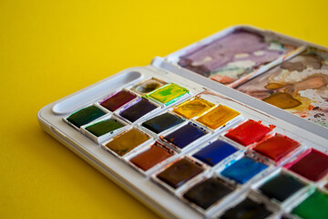 A colorful watercolor palette used for painting