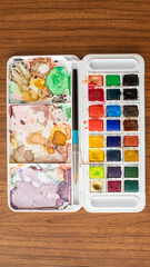 A colorful watercolor palette used for painting