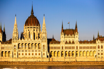 The Parliament in Budapest photographed on a sunny day - obrazy, fototapety, plakaty