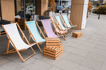 colored sun loungers near the cafe, rest in the city