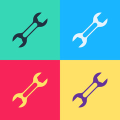 Pop art Wrench spanner icon isolated on color background. Vector