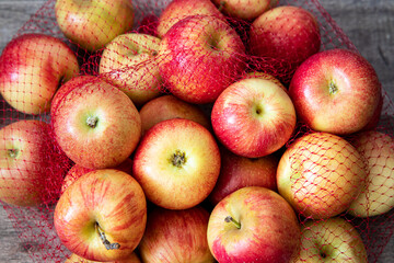 Red apples on a wooden table.