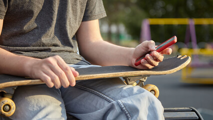 Skate on his knees phone in his hands dawn