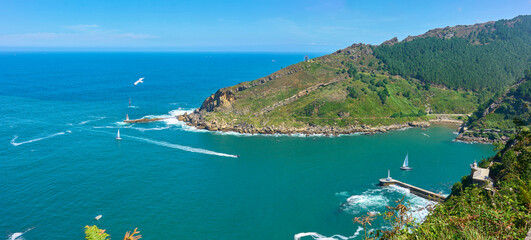 Naklejka premium Panoramic view of the Outer dock of the Port of Pasajes at the mount of the Pasaia river. View from Cape Cabo de la Plata. Puntas de San Pedro, Pasajes, Gipuzkoa, Basque country, Spain.