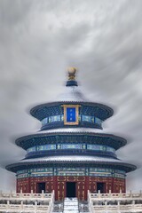 Vertical shot of the Historic temple of Heaven in Beijing, China against a grey cloudy sky