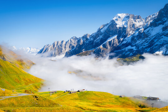 Nature. Mountains and clouds in the valley. Natural landscape high in the mountains. Mountain field in the clouds. Landscape in the summertime.