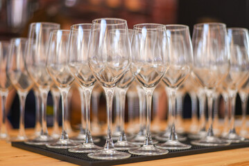 Set of new bar glassware on the bar counter. lots of empty glasses