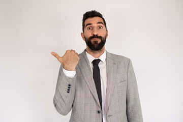 Portrait of emotional bearded man. Male in suit gesturing, making funny face. Portrait, emotion concept